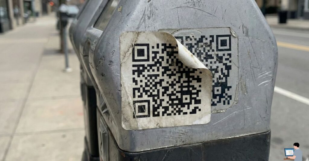 Fake QR code sticker pasted on parking meter scam.