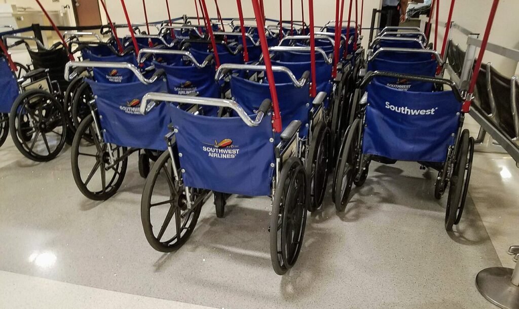 Gate Checking a Wheelchair: How It Works and How to Protect Your Chair 2 Airport wheelchairs waiting at a departure gate in an airport terminal