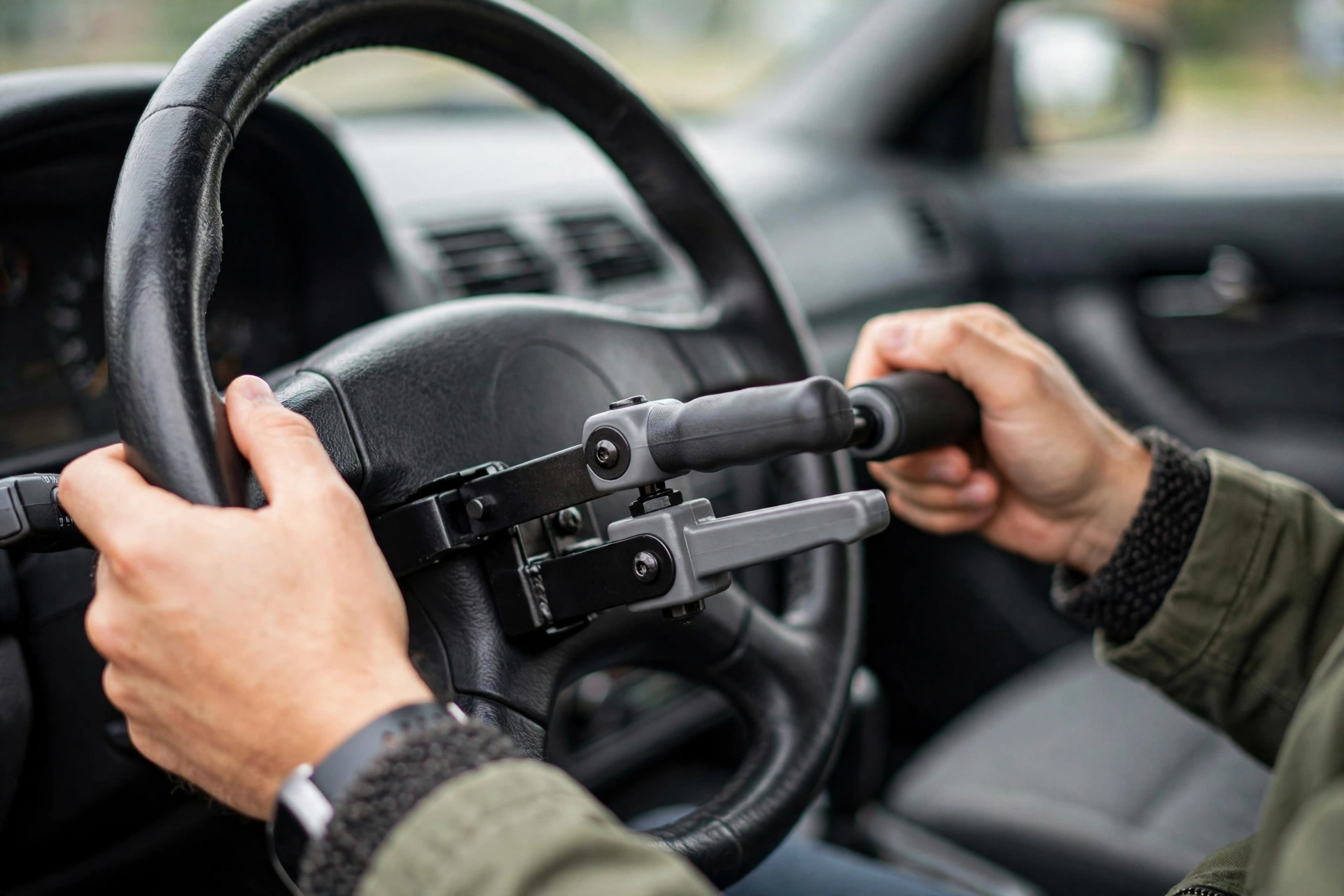 Accessible Road Trips: Rentals, Hand Controls, and Planning 2 Car steering wheel fitted with portable push-pull hand controls for disabled drivers
