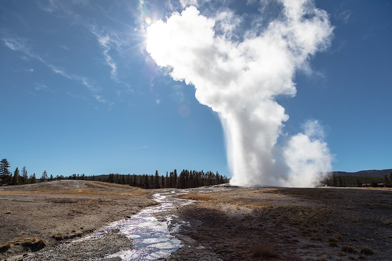 Yellowstone Wheelchair Access Guide: Geysers, Boardwalks, and Wildlife Viewing 2 Old Faithful geyser erupting high into a blue sky above the Upper Geyser Basin in Yellowstone National Park
